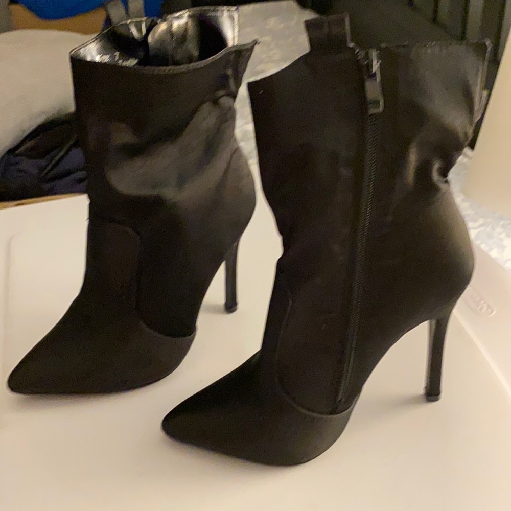 Never worn size 7 black heeled booties w side zip